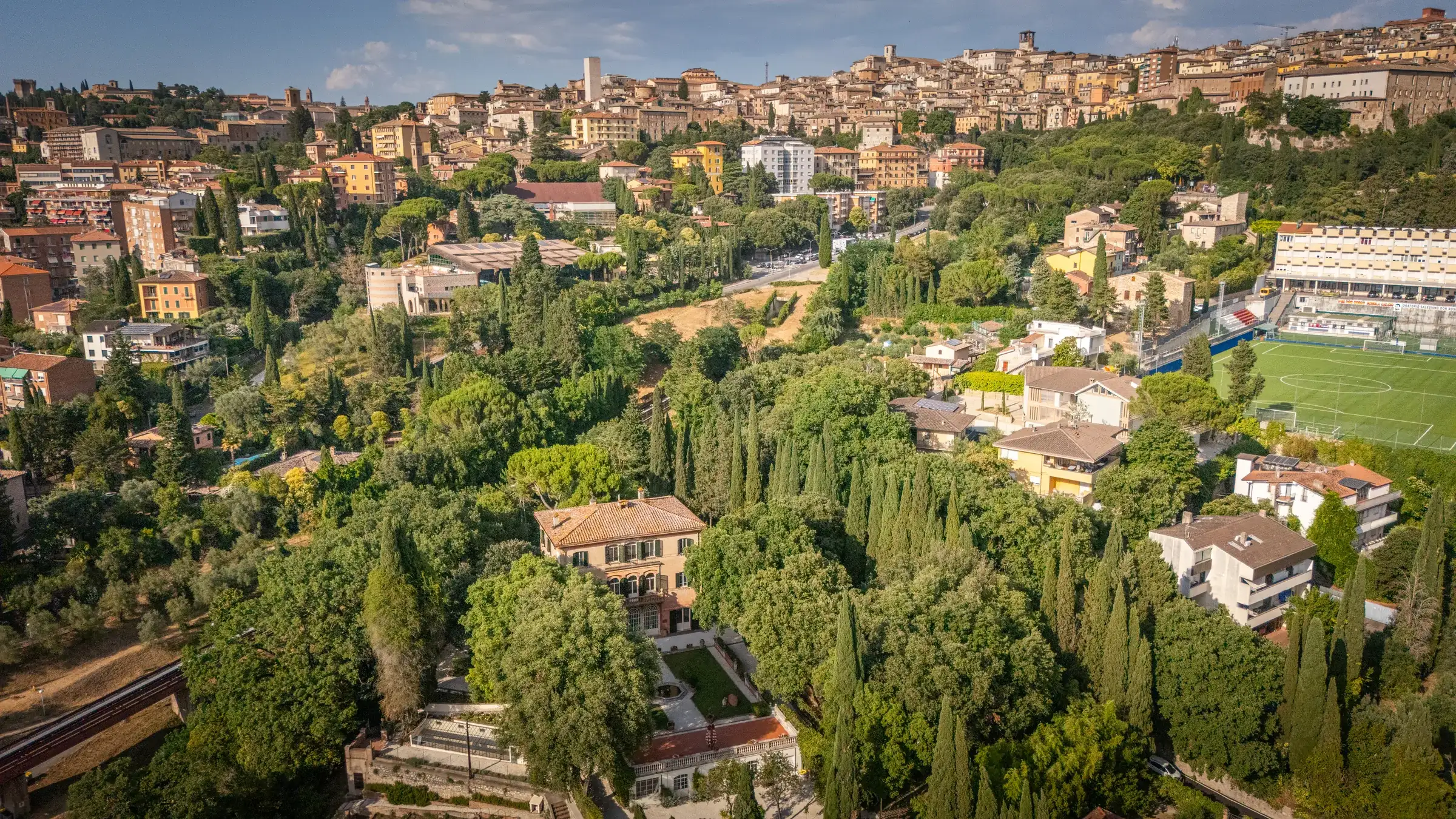 Aerial view of the hillside gardens with the historic centre of Perugia in the background