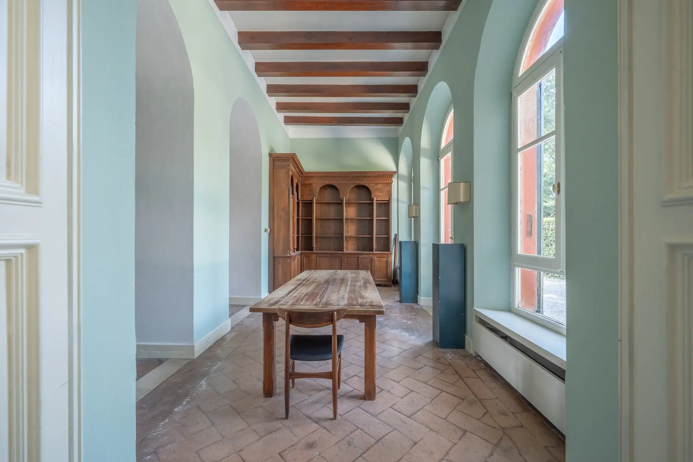 Long hallway with arched windows