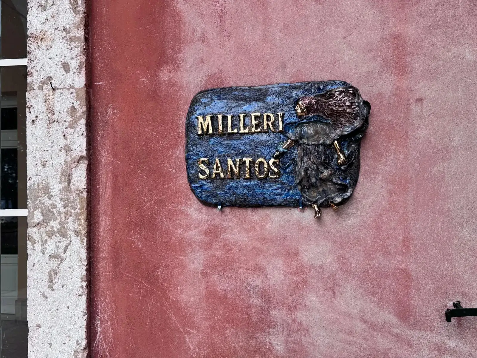 Milleri Santos name plaque on the façade