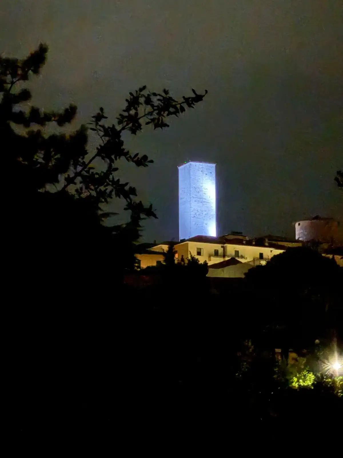The villa illuminated at night